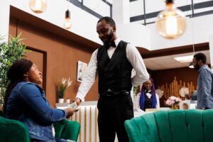 Generous hotel guest giving cash tip